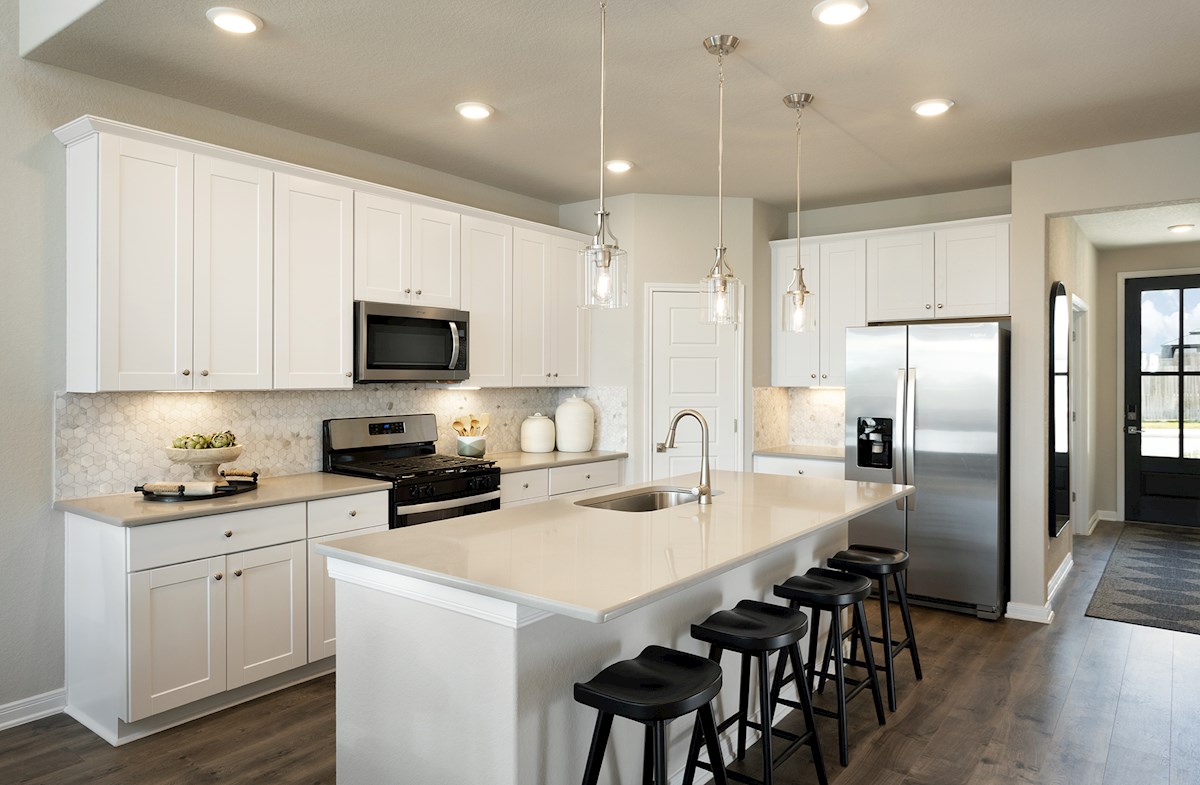 kitchen with white countertops & cabinets