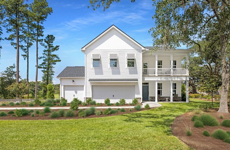 two-story coastal white home with blue door