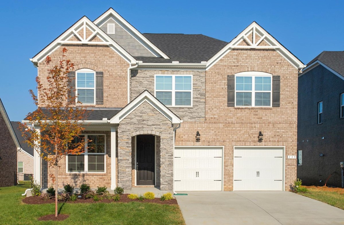 exterior of home with brick and stone archway